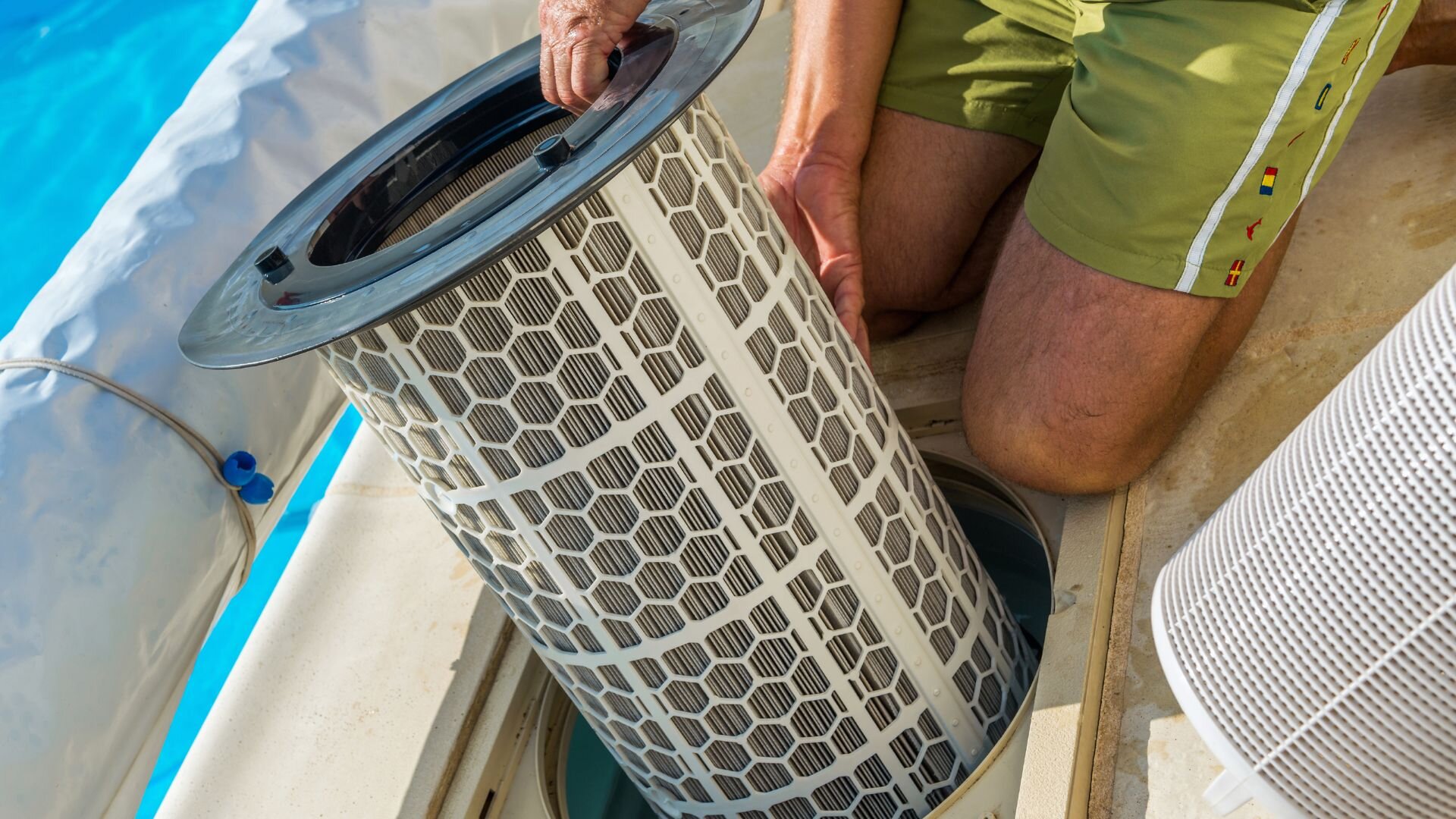 Man Replacing Pool Filter Pool